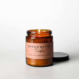 The Classic Collection candle in an amber jar with a 'Brown Butter Pumpkin' label on a white background