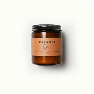 The Classic Collection amber jar candle with a 'Caramel Corn' label on a white background