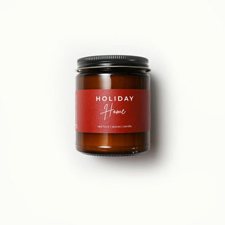 The Classic Collection amber jar candle with a 'Holiday Home' label on a white background