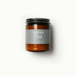The Classic Collection amber jar candle with a 'Silver Birch' label on a white background