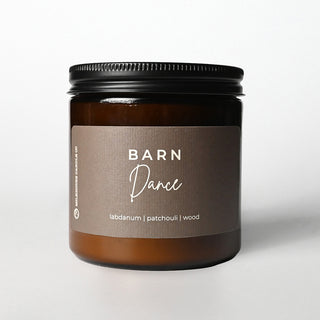 Candle jar labeled 'Barn Dance' with a brown label on a white background