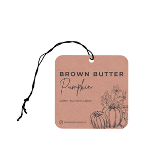 Light brown air freshener tag with 'Brown Butter Pumpkin' text and pumpkin illustration on a white background