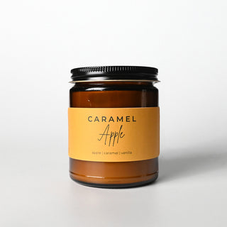 Candle jar labeled 'Caramel Apple' on a white background
