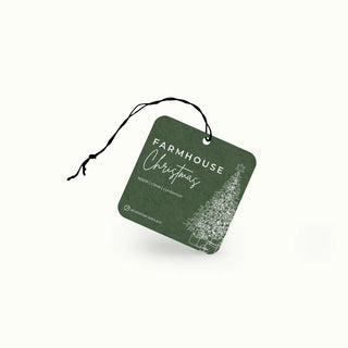 Green 'Farmhouse Christmas' air freshener tag on a white background
