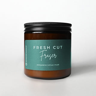 Candle jar labeled 'Fresh Cut Fraser' on a white background