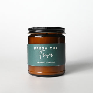 Candle jar labeled 'Fresh Cut Fraser' on a white background