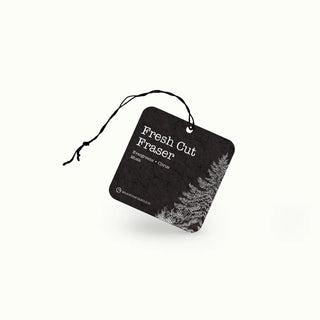 Black air freshener tag with 'Fresh Cut Fraser' text and tree design on a white background