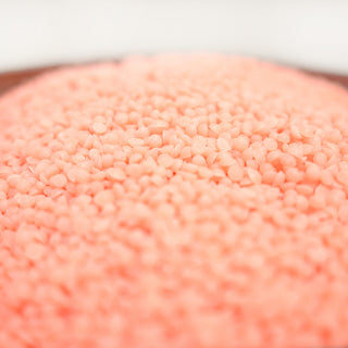 Close-up of Peaches & Poppies scented wax beads