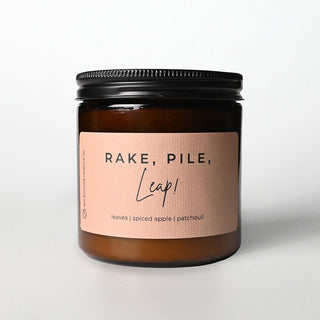 Candle jar with a tan label on a white background