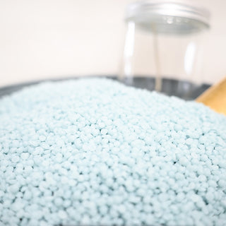 Close-up of blue wax beads with a blurred background