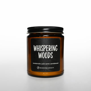 Candle jar labeled 'Whispering Woods' on a white background