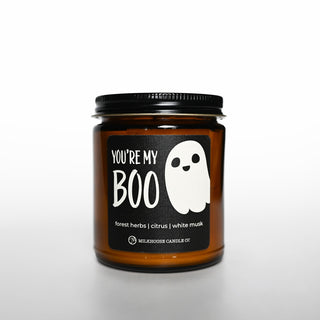 Candle jar with a ghost label on a white background