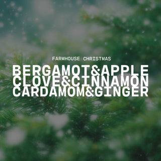 'Farmhouse Christmas' text overlay on a blurred green background with Christmas scent notes of bergamot & apple, clove & cinnamon and cardamom & ginger