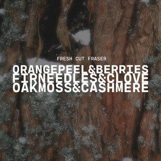 Text overlay on a snowy tree bark background with product name of Fresh Cut Fraser and description of orange peel & berries, fir needles & clove and oak moss & cashmere