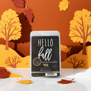 Wax melt package with 'Hello Fall' text on an autumn-themed background