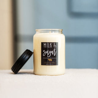 Candle labeled 'Milk & Sugar' on a neutral background
