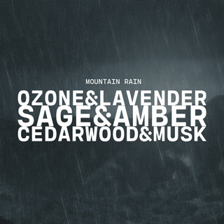 Text overlay on a rainy background with product name of Mountain Rain and description of ozone & lavender, sage & amber and cedarwood & musk