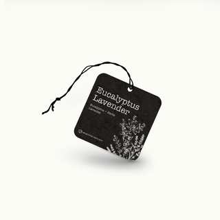 Black air freshener tag with 'Eucalyptus Lavender' text and botanical illustration on a white background