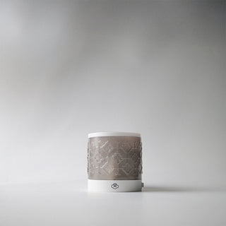 A light grey patterned wall melter against a white background