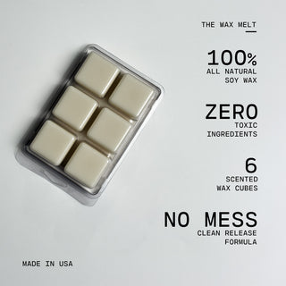 Pack of six scented wax cubes in a clear container with text highlighting features on a white background.