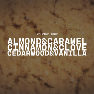 Welcome Home with a text overlay on a textured brown background with a product description of almond & caramel, cinnamon & clove and cedarwood & vanilla